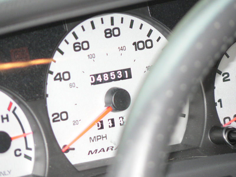 White-faced MPH speedometer with odometer reading 048531 and 'MARA' badge text