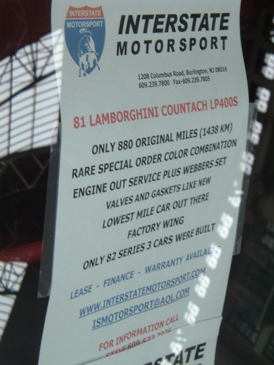 Interstate Motorsport for-sale sign for an '81 Lamborghini Countach LP400S with 880 original miles