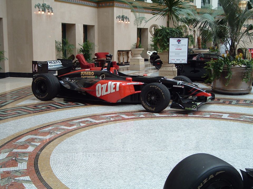Black and red racing car with Ozjet livery