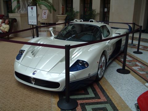 1999 Mercury Grand Marquis - Maserati MC12 on display, a rare supercar with distinctive styling and racing heritage.