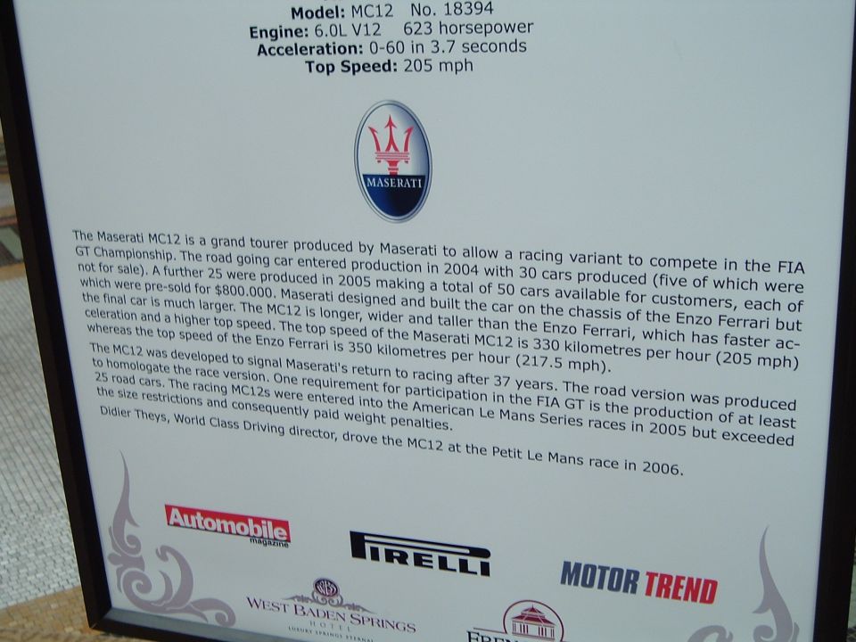 Maserati MC12 No. 18394 show placard with specs, history text and sponsor logos