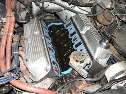 1985 Ford LTD Crown Victoria - Close-up of a Ford engine during maintenance, with valve covers off.