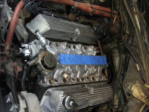 1985 Ford LTD Crown Victoria - The engine bay shows a V8 engine with aftermarket valve covers and various hoses and wiring.
