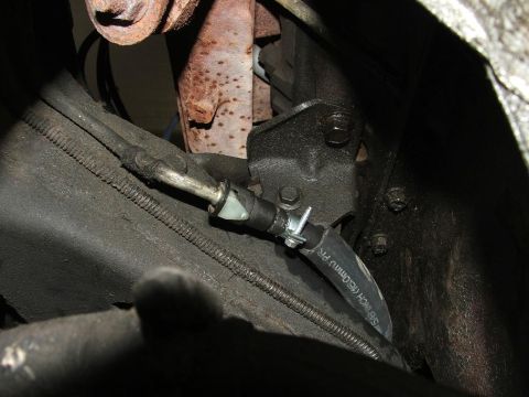 1985 Ford LTD Crown Victoria - Brake line and hose assembly with clamp and metal fittings visible.
