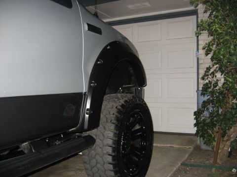 1979 Ford Bronco - The vehicle has aftermarket fender flares and aggressive off-road tires.