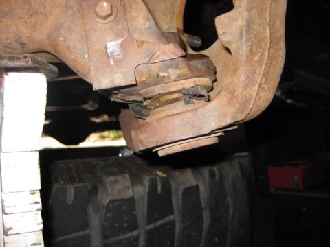 1995 Ford Bronco - This photo shows a worn ball joint, likely needing replacement, on a vehicle's suspension.
