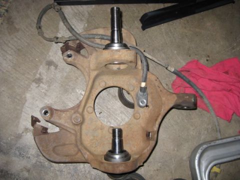 1995 Ford Bronco - Suspension knuckle assembly with ball joints, likely removed for replacement or repair.