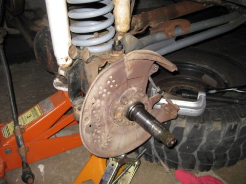 1995 Ford Bronco - Front wheel hub and brake assembly, likely undergoing repair or maintenance.