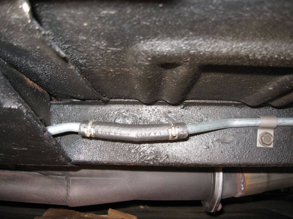 Underside view of a car's gas line with text that reads 'GAS AAAA'
