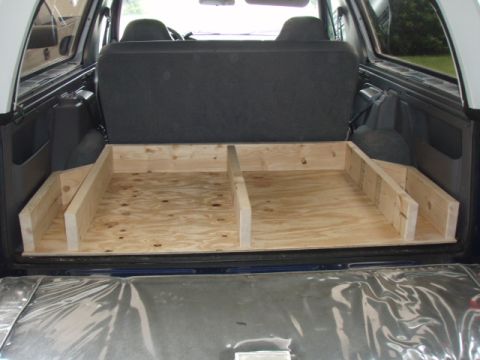 1996 Ford Bronco - I made the frame out of 2x6's. Here is what it looks like without the top. I later put carpeting in the side bin area, since there is no dr…