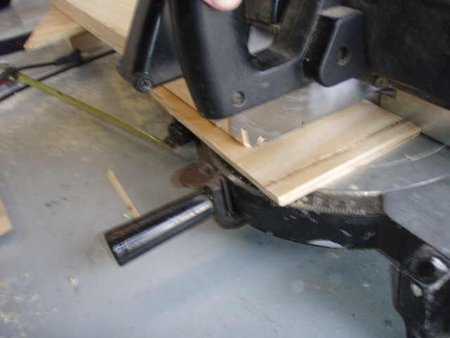 Since i was using a 10" chop saw, you have to add a scrap piece of wood to the base so it will cut the 2x6 all the way through or it will leave a 1" piece that will usually splinter, leaving more work to smooth it out.