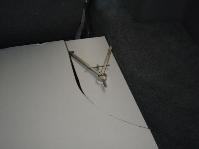 Hold the protractor level thoughout the mark.  I put the cut piece back for photo purposes.  You may have to make minor corrections as I did.