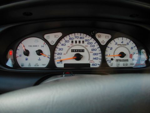 1997 Ford Taurus - Dashboard gauges including speedometer, tachometer, fuel, and temperature. Odometer shows 64,285 miles.
