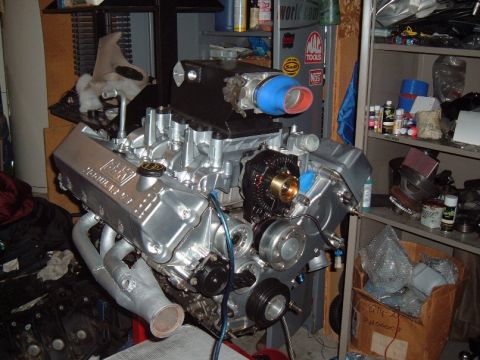 2007 Ford Mustang - A Ford V8 engine is shown in a workshop setting, possibly undergoing modification or repair.