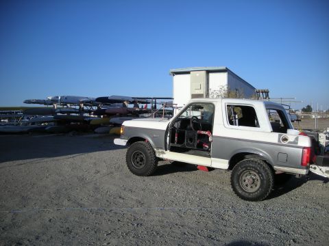 1991 Ford Bronco - This 1991 Ford Bronco is shown with its doors removed, parked in an outdoor lot.