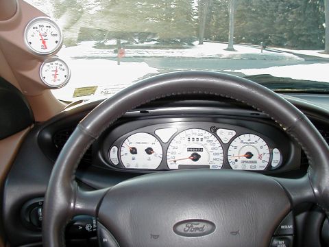 1997 Ford Taurus - Dashboard gauges and steering wheel are visible from the driver's perspective inside the vehicle.