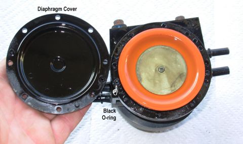 1983 Ford Bronco - Dual Function Reservoir Cover Remove the 8 screws from the diaphragm cover & lift it off carefully. Do not distort the orange diaphragm or…