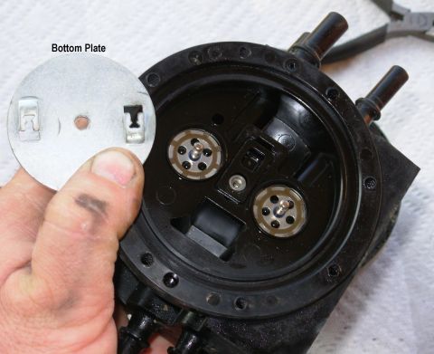 1983 Ford Bronco - Dual Function Reservoir Plate Using needle-nose pliers, push the valve pushrods out of the clips in the bottom plate (by rotating the plate…