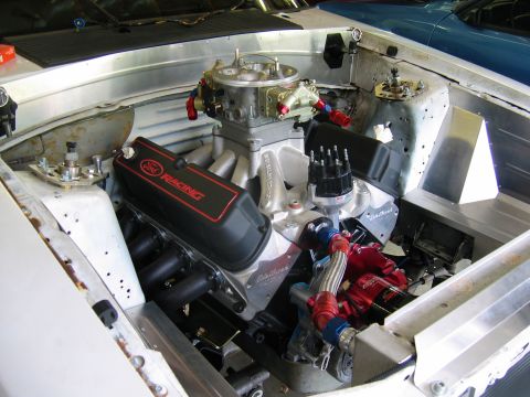1992 Ford Mustang - Engine bay view showing a performance V8 engine with custom components and braided hoses.