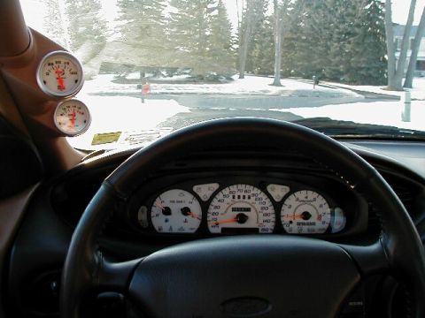1997 Ford Taurus - Interior view of a 1997 Ford Taurus showing the dashboard gauges and steering wheel.