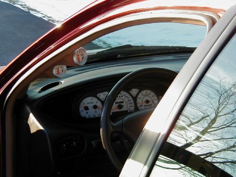 1997 Ford Taurus - Interior view of a 1997 Ford Taurus, aftermarket gauges on the A-pillar and standard dashboard instrumentation.