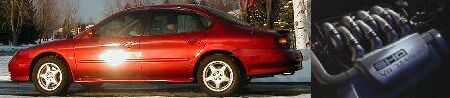 1997 Ford Taurus - A red sedan is seen from the side on a winter day.