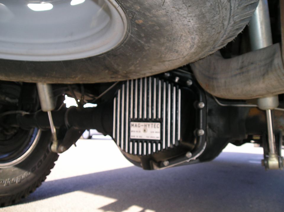 Underbody view of a rear differential with finned Mag-Hytec cover beneath a truck