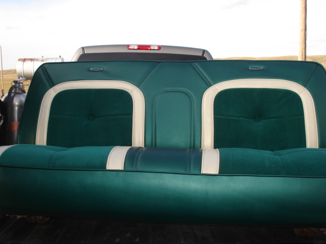Green and white upholstered bench seat