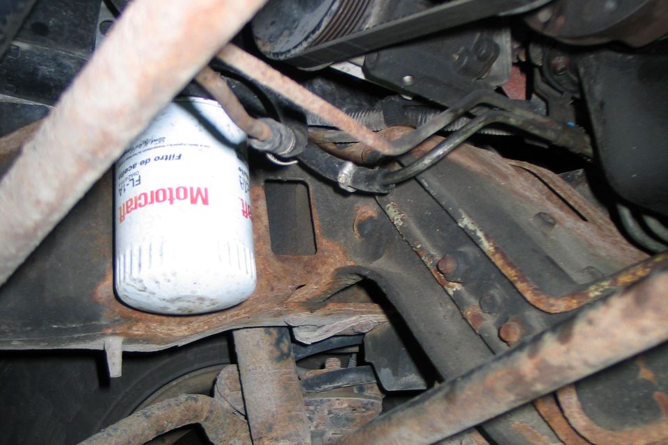 Motorcraft oil filter on rusty engine components