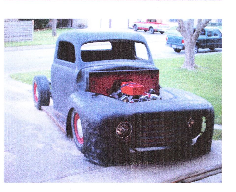 Unfinished 1948 Ford F-1 truck, matte black, red wheels, engine exposed