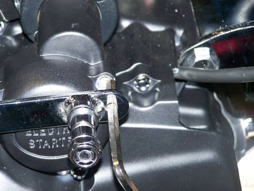 Close-up of a motorcycle engine case marked ELECTRIC STARTER