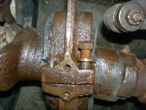 1996 Ford Bronco - A close-up view of a heavily rusted differential housing and axle assembly, possibly from a 1996 Ford Bronco. The image focuses on a bolted…