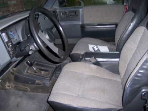 1991 Ford Bronco - Interior view of a car's cabin, showing the seats and dashboard.