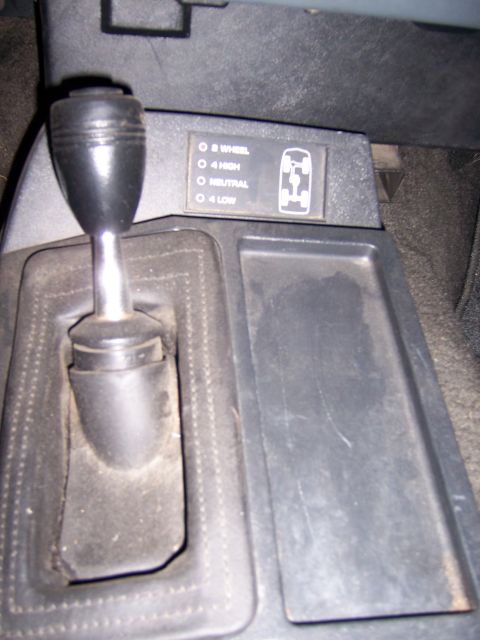 1991 Ford Bronco - Transfer case shifter and indicator panel for 4WD vehicle.