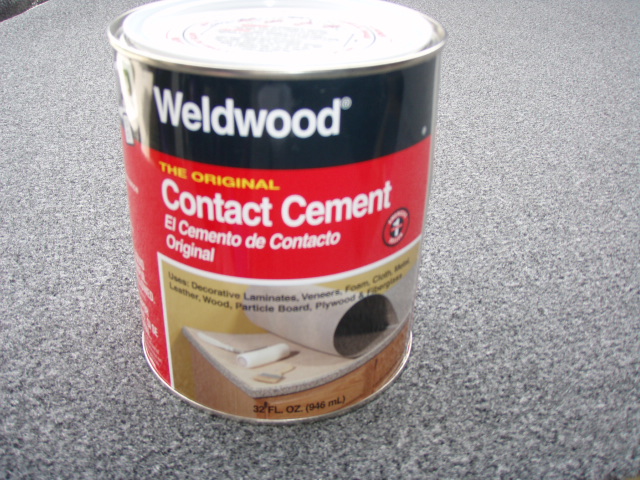 I used this stuff to glue the carpet to the top.