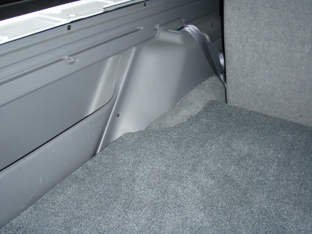 1996 Ford Bronco interior cargo area with grey carpet and plastic trim