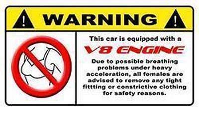 1988 Mercury Grand Marquis - This warning sticker advises females to remove tight clothing due to possible breathing problems under heavy acceleration from a V8 engine.