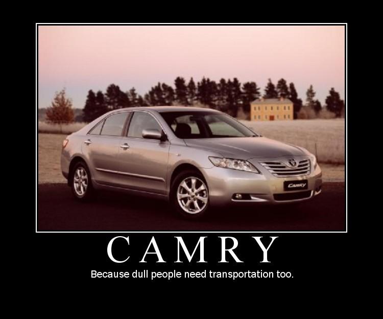 Silver Toyota Camry sedan parked outdoors, front 3/4 view