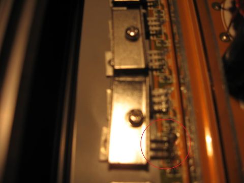 1992 Ford Crown Victoria - Close-up view of a circuit board with visible electronic components and a red circle marking a specific area.
