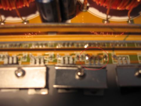 1992 Ford Crown Victoria - Close-up view of a circuit board showing components, with a red circle highlighting damaged areas.