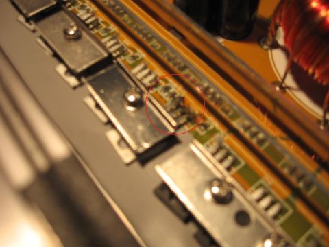 1992 Ford Crown Victoria - Electronic circuit board detail with components visible, focus on a specific area.