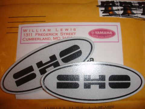1990 Ford Taurus - Two SHO emblems are shown on an envelope with a return address and a Yamaha logo.