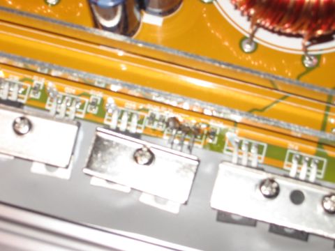 1992 Ford Crown Victoria - Close-up of electronic components on a circuit board, showing signs of damage and a website logo.