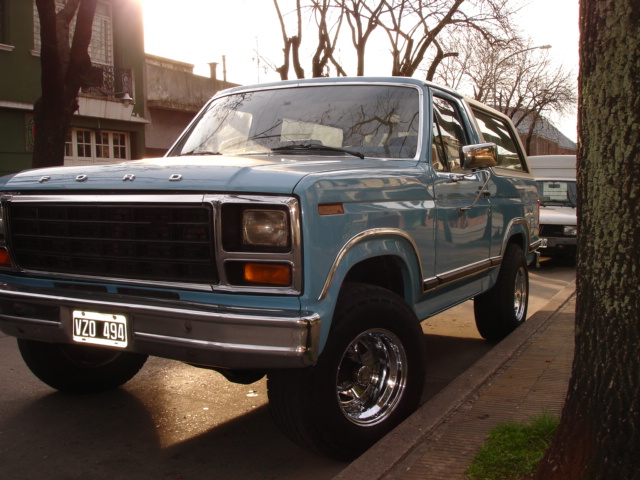 Light blue Ford Bronco parked on street, front quarter view. License plate VZO 494