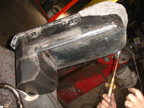 1980 Ford Bronco - Custom oil pan modification in progress, likely for an engine swap.