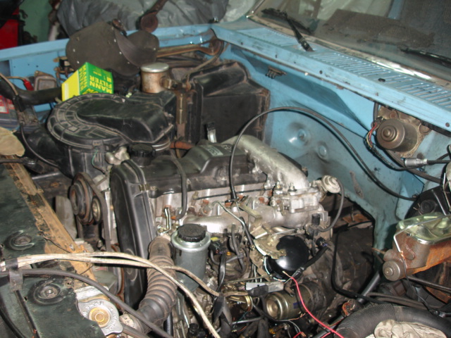 Engine bay with air filter and engine components visible