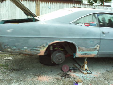 1967 Ford Galaxie - 1967 Ford Galaxie undergoing bodywork, showing rust damage and primer coat.