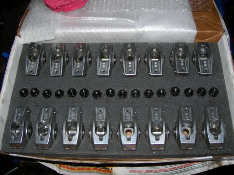 1984 Ford Bronco - A new set of aluminum rocker arms and accompanying nuts are neatly arranged in a black foam insert within a white box. The rocker arms are…