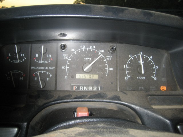 1995 Ford Bronco dashboard with speedometer, tachometer, odometer, and fuel gauge.