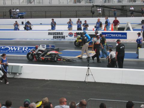 1992 Ford Mustang - Two drag racing motorcycles are lined up on the track during the NHRA 08 Carolina Nationals event.